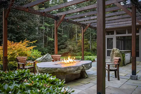 Fire pit under pergola on patio