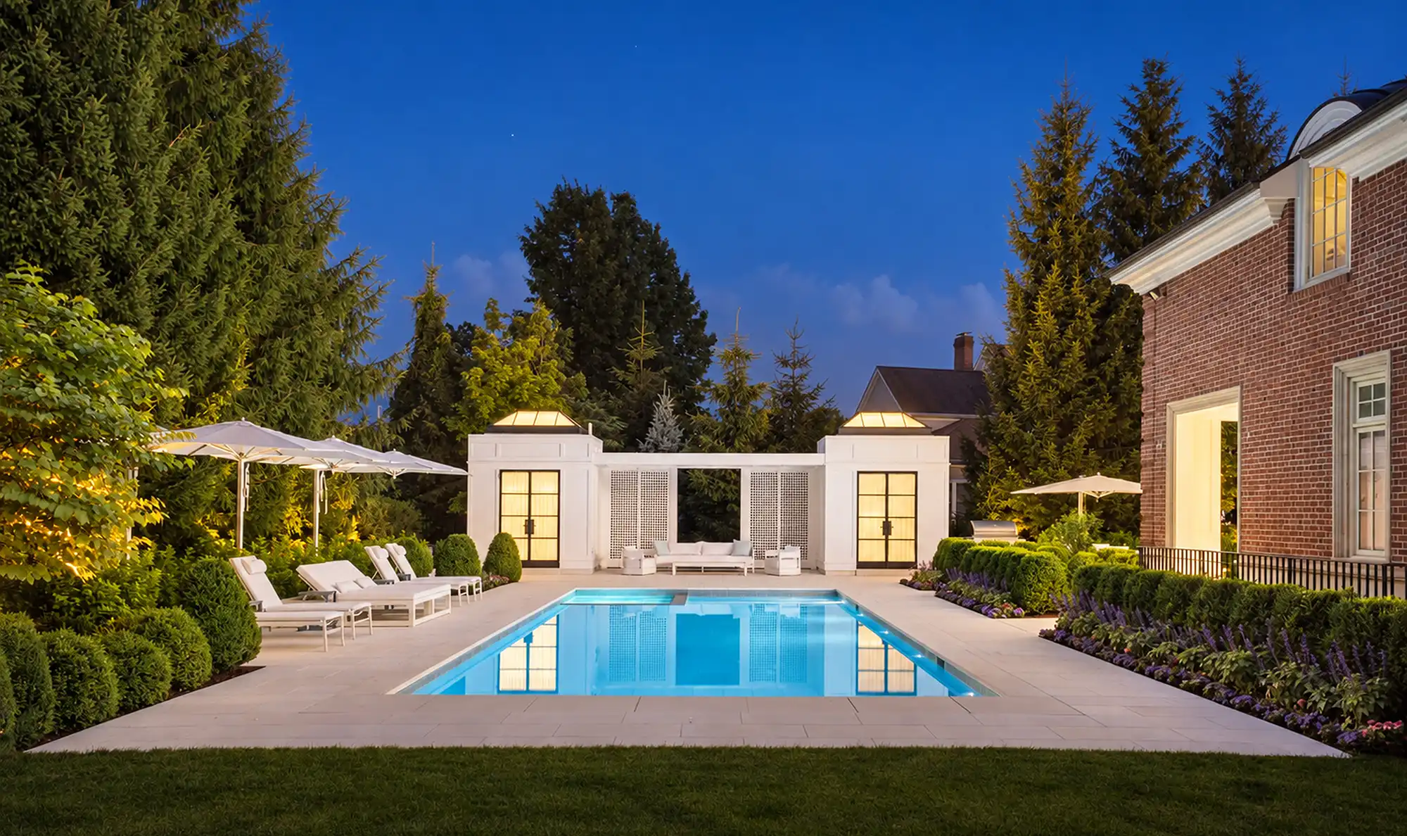 Pool landscaping with white club house