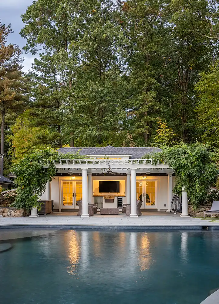 Pool in front of Pool house with pergalo