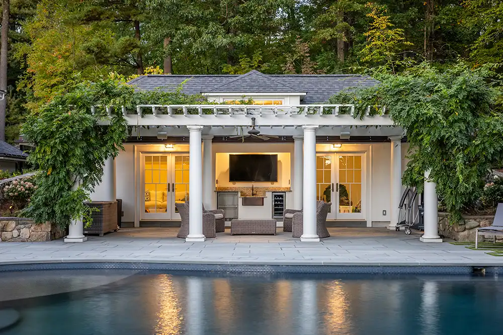 Pool in front of Pool house with pergalo